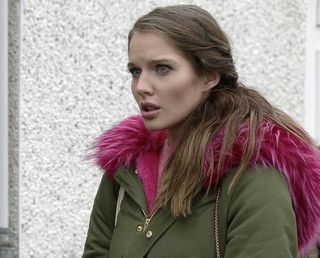 Rosie Webster wearing a coat with a pink fur hood
