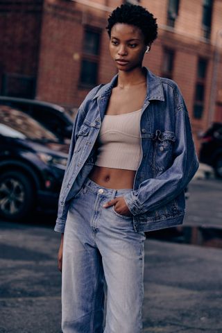Woman at Fashion Week wearing a denim jean jacket