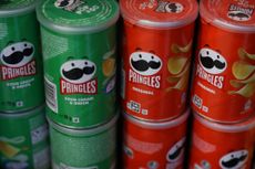 Closeup of Pringles, which is owned by Kellanova, in sour cream and onion and original