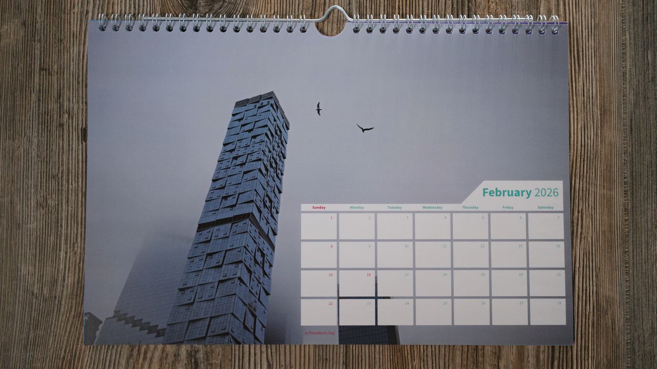 A wall calendar from Saal on a wood background