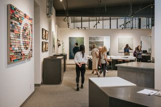 Visitors look at art at Bergamot Station Arts Center