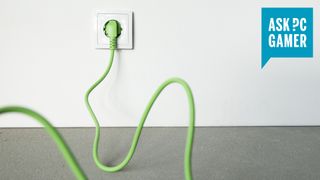 A kinky, green cable in a wall socket