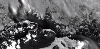 A NASA satellite image shows where the ice has pulled away from Greenland's north coast, a phenomenon that's never been recorded before.