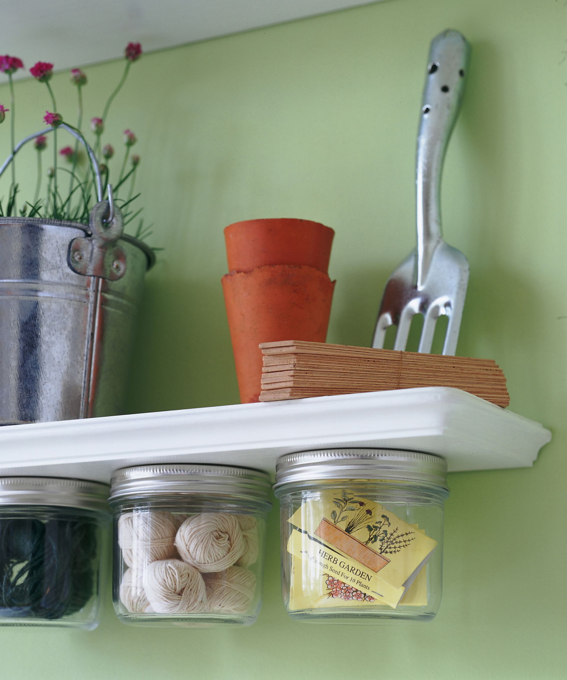 Storage ideas : garden shed / utility room with jars stuck underneath shelf
