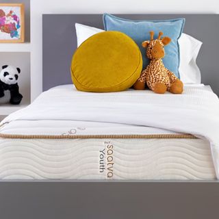 Saatva Youth Mattress on a bed.