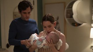 Penn Badgley and Victoria Pedretti tend to their baby in You.