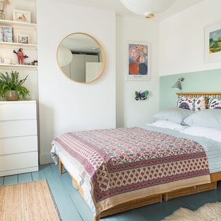 bedroom with green half painted wall
