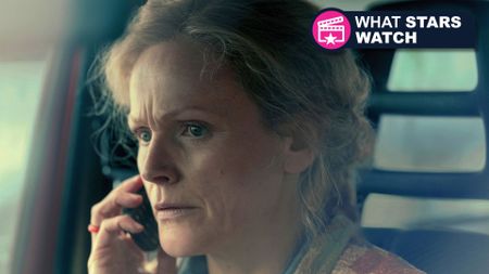 Maxine Peake talks on the phone with the What Stars Watch logo on her right