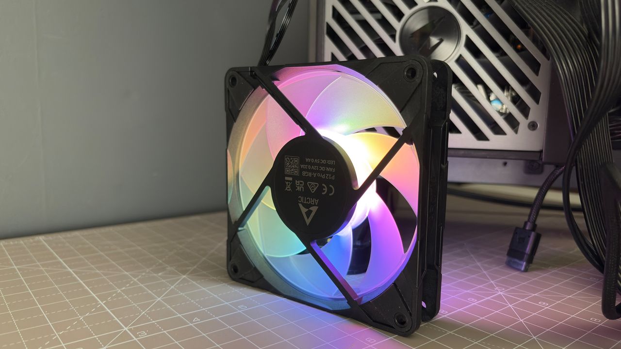 Various PC fans on a table with testing equipment for a round of batch tests.