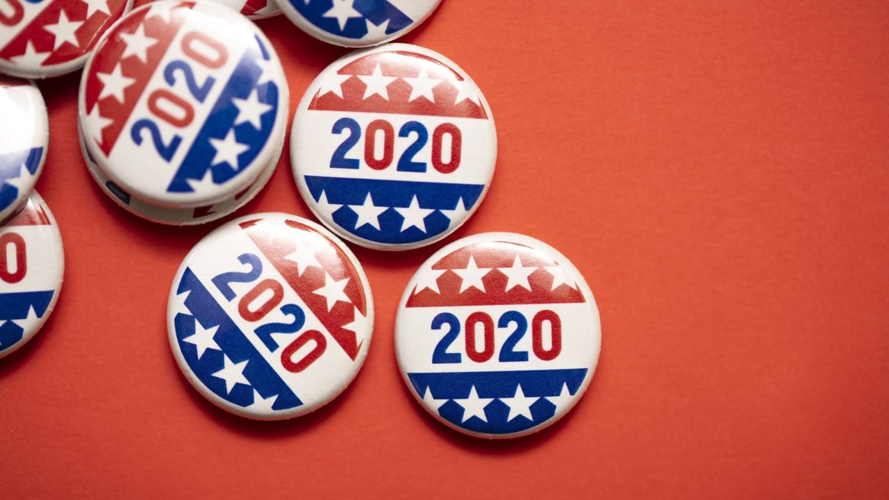 2020 election buttons sitting against a red background