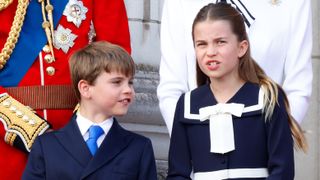 Prince Louis of Wales and Princess Charlotte of Wales watch an RAF flypast from the balcony of Buckingham Palace after attending Trooping the Colour on June 15, 2024