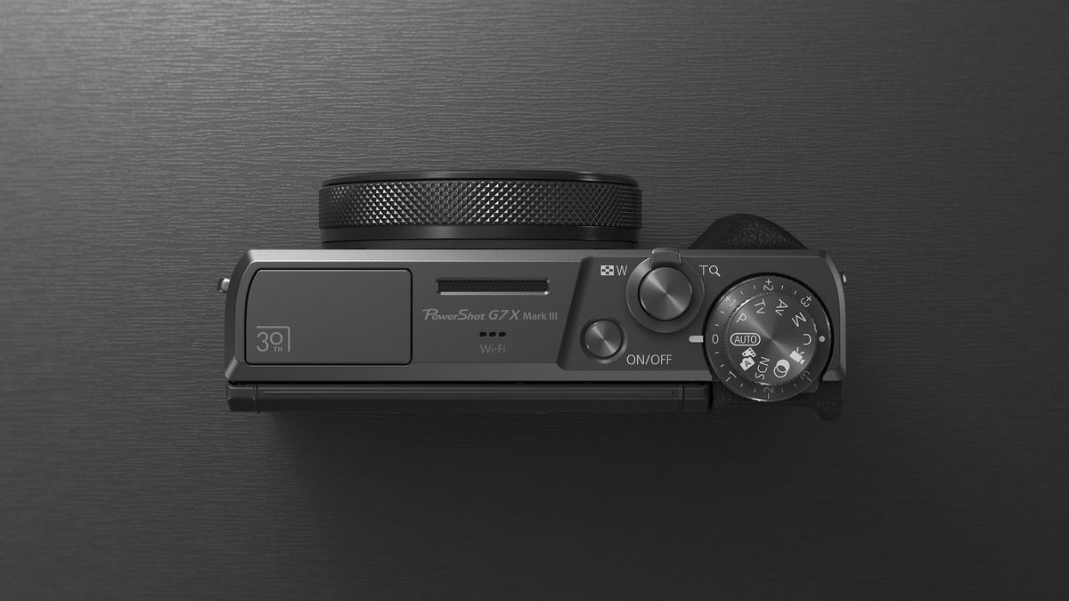 Top plate of the Canon PowerShot G7 X Mark III Anniversary Edition in graphite, on a graphite-type surface