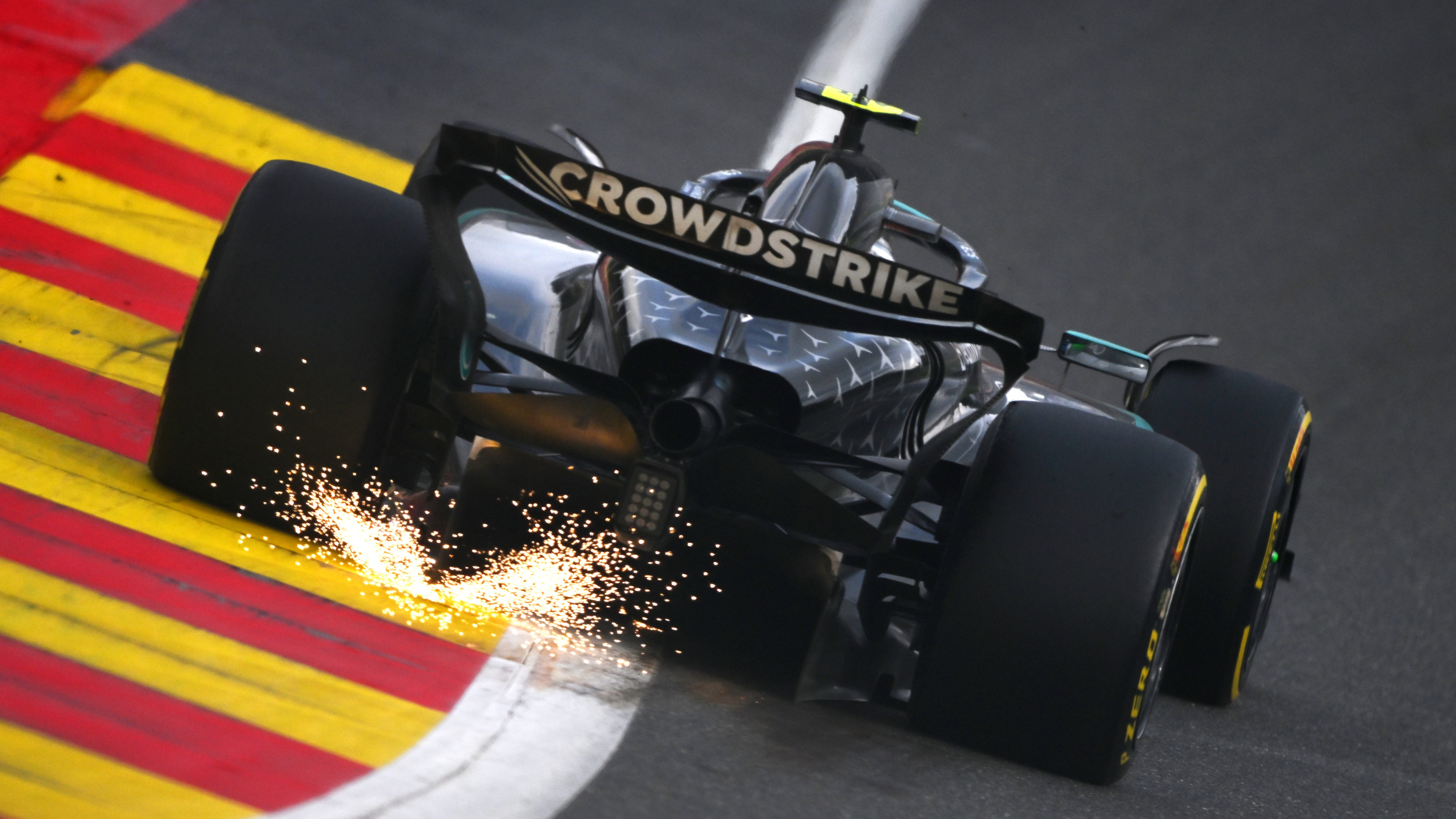 Sparks fly behind Andrea Kimi Antonelli of Italy driving the (12) Mercedes AMG Petronas F1 Team W16 on track during the F1 Grand Prix of Belgium at Circuit de Spa-Francorchamps on July 27, 2025 in Spa, Belgium.