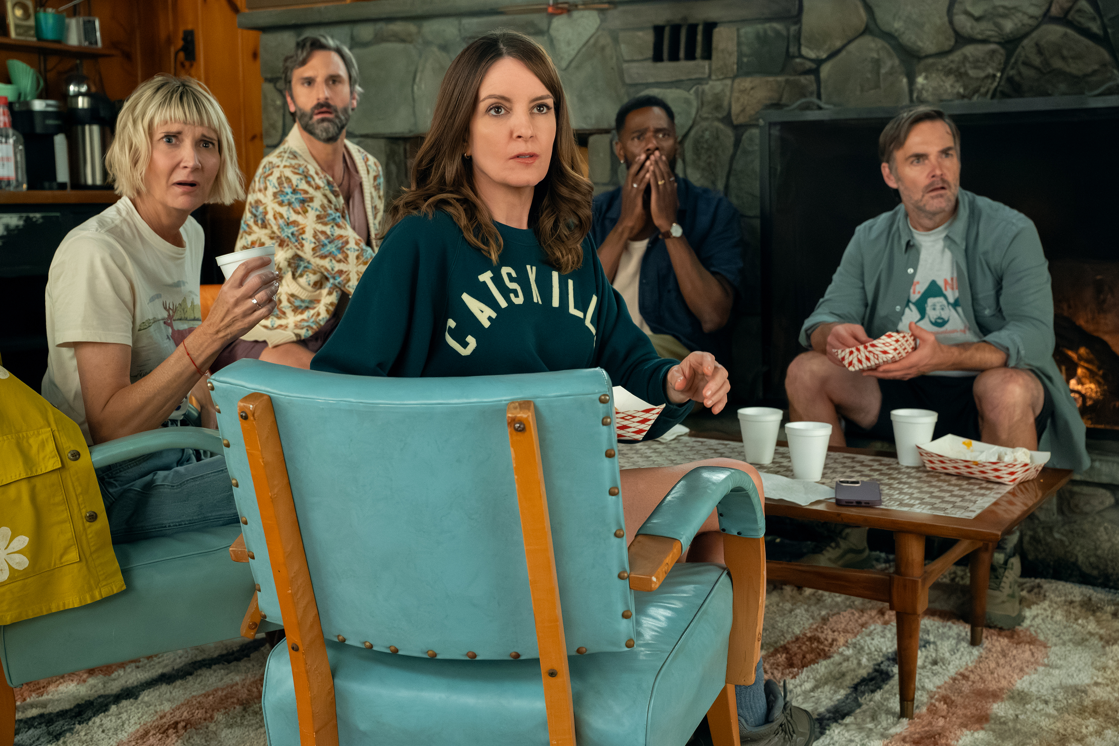 Kerri Kenney-Silver as Anne, Marco Calvani as Claude, Tina Fey as Kate, Colman Domingo as Danny, and Will Forte as Jack in a cabin living room in the four seasons season 2