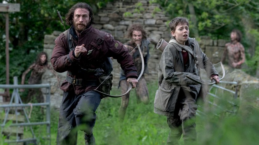 Aaron Taylor-Johnson and Alfie Williams fleeing from Infected emerging from the woods in 28 Years Later.