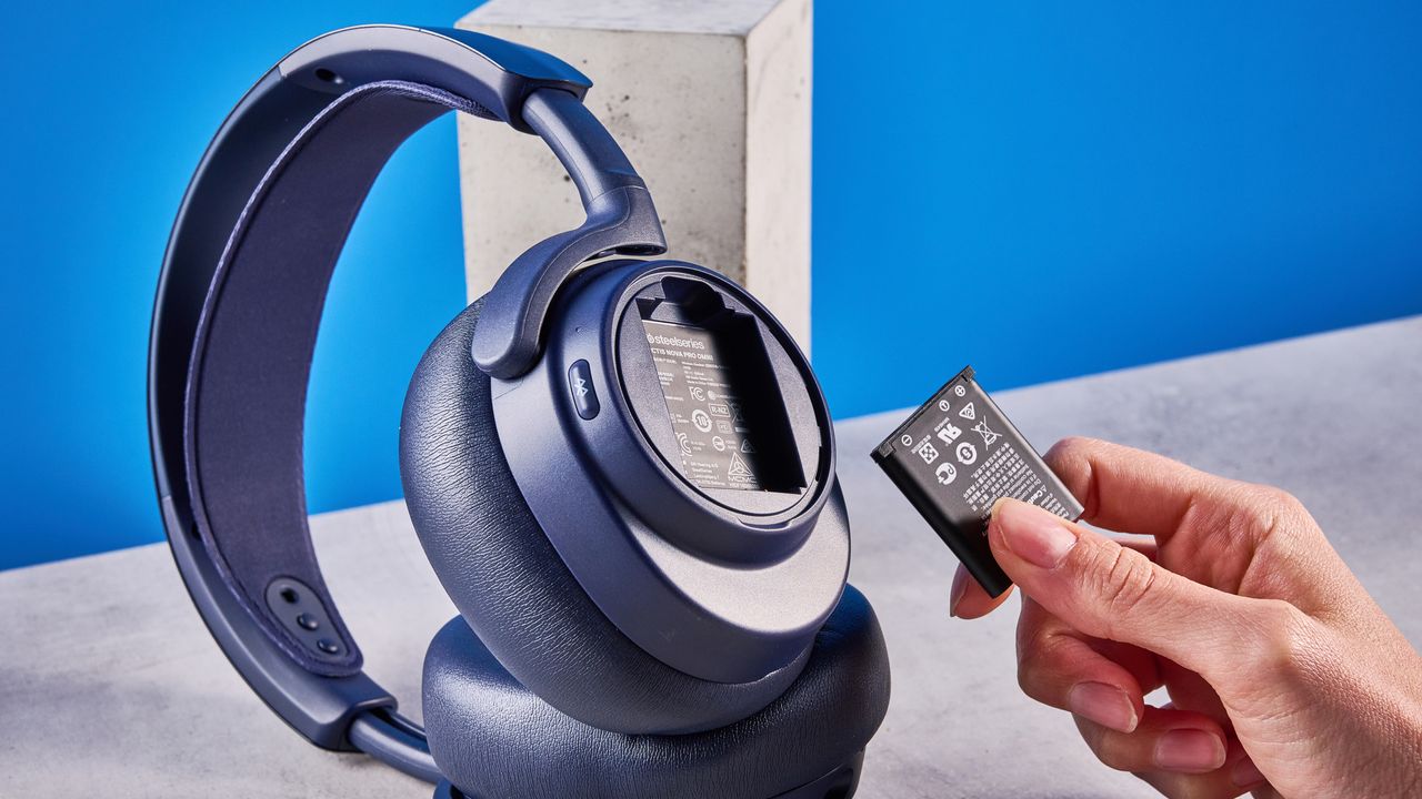 The SteelSeries Arctis Nova Pro Omni on a stone surface against a blue background