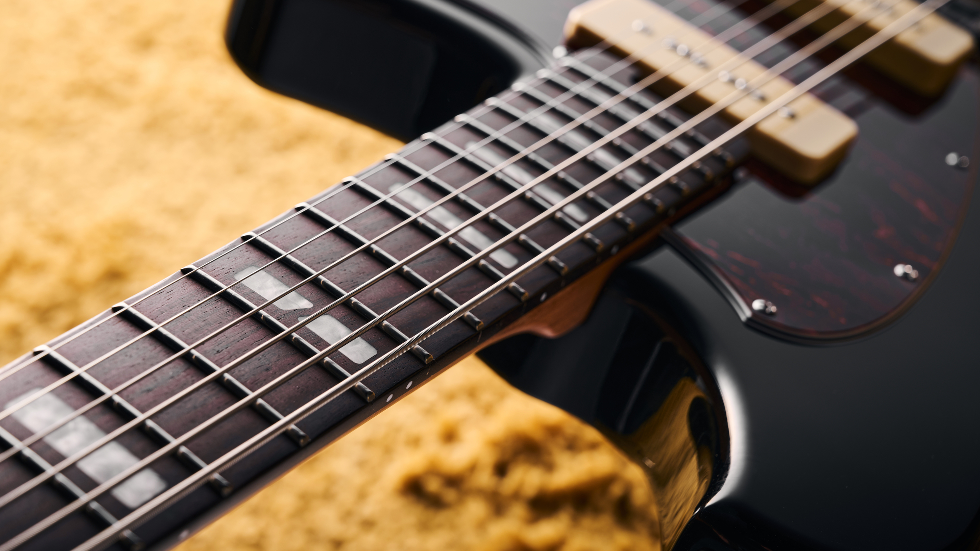 The fingerboard of a Orangewood Del Sol Baritone guitar
