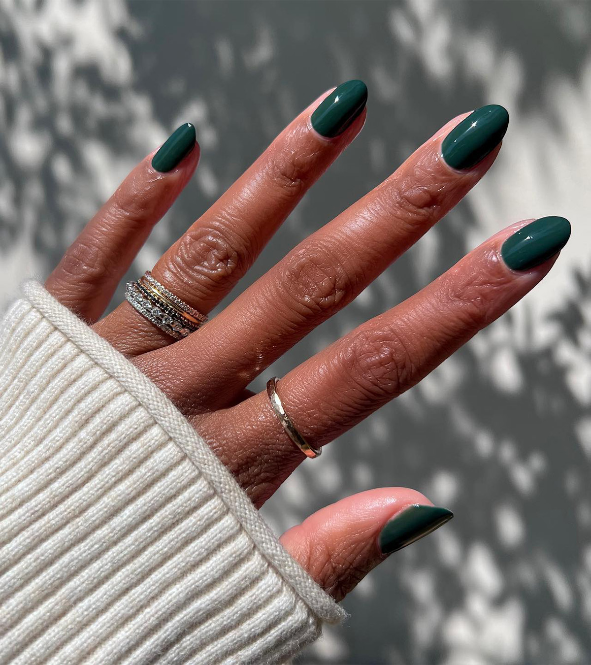 A forest green manicure by Christiana Hooks.
