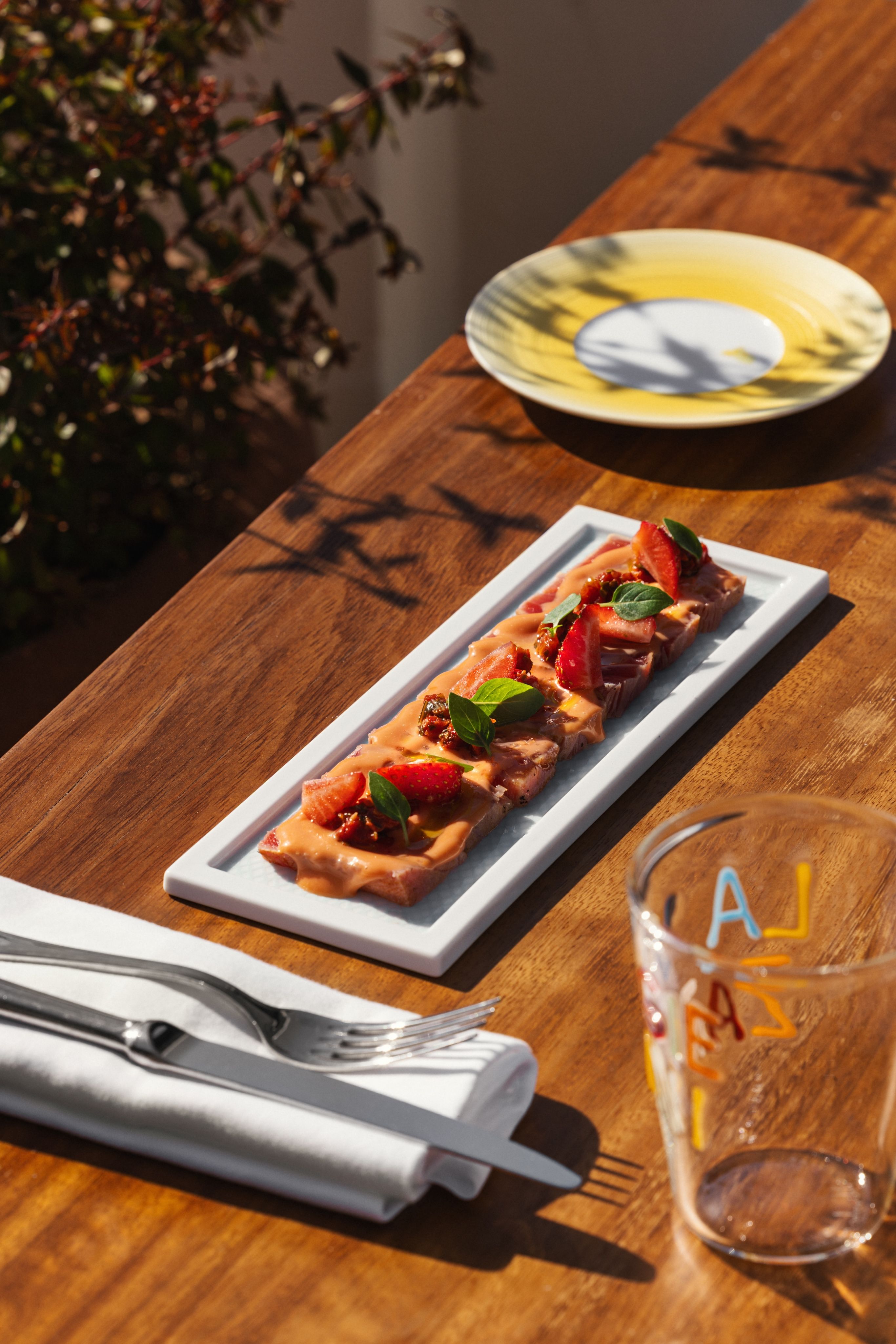 A close-up of tableware at an outdoor restaurant in Monaco