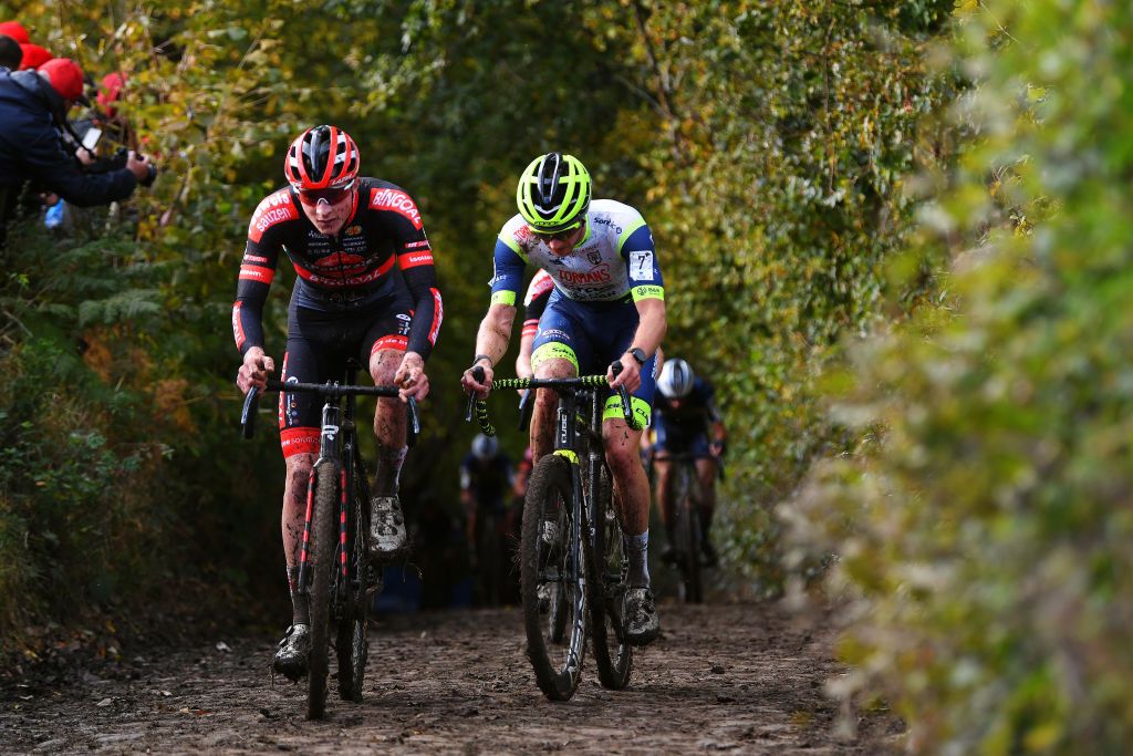 OUDENAARDE BELGIUM NOVEMBER 01 LR Toon Vandebosch of Belgium and Team Pauwels Sauzen Bingoal and Corne Van Kessel of The Netherlands and TormansCircus Cyclo Cross Team compete during the 32nd Koppenbergcross Grand Prix Jolien Verschueren 2021 Mens Elite Koppenbergcross Oudenaarde X2OBadkamersTrofee on November 01 2021 in Oudenaarde Belgium Photo by Luc ClaessenGetty Images