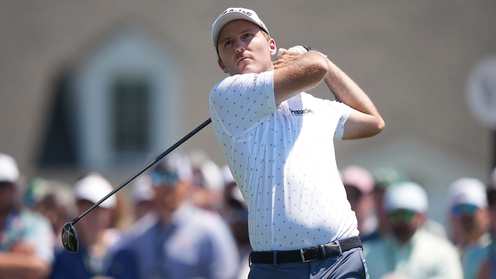 Russell Henley hits a fairway wood off the tee