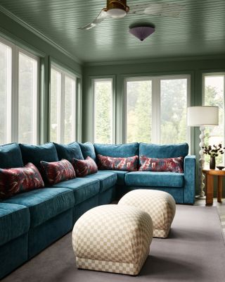 Blue velvet corner sofa in a living room