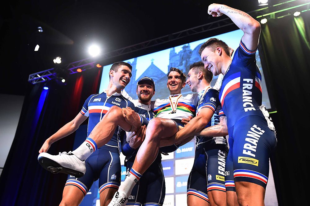Team France lift up their new U23 world champion Kevin Ledanois (France)