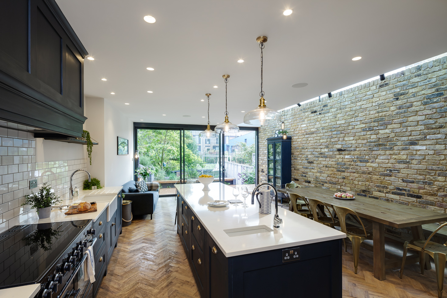 an open plan kitchen with an interesting lighting scheme