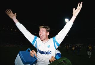 Chris Waddle celebrates victory for Marseille over AC Milan in the European Cup in March 1991.