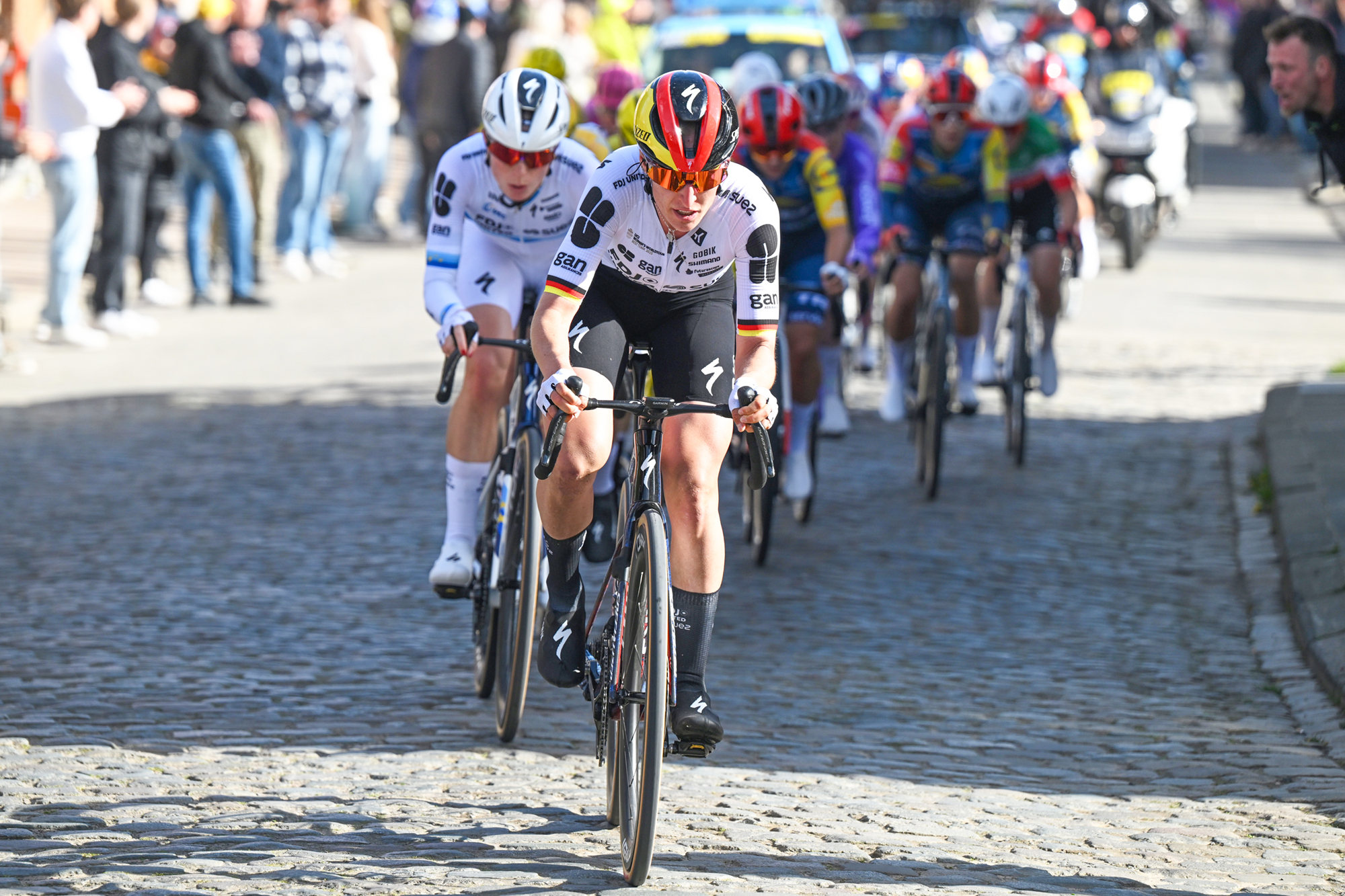 Franziska Koch (FDJ United-SUEZ) leads teammate and eventual race winner Demi Vollering over a cobbled sector at the 2026 Tour of Flanders