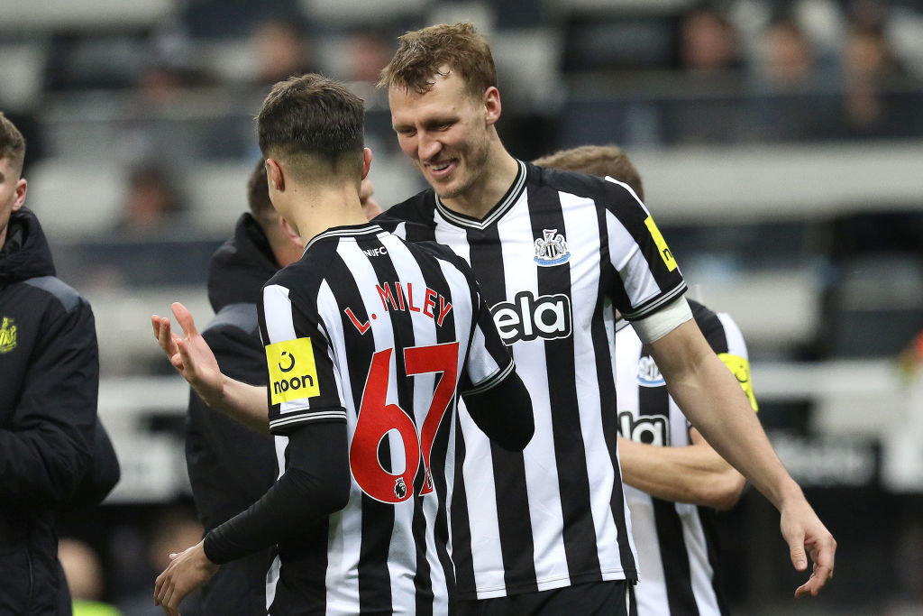 Premier League and Newcastle United pair Dan Burn celebrating with Lewis Miley during the Premier League match between Newcastle United and Fulham at St. James's Park in Newcastle, on December 16, 2023.