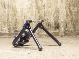 A Wahoo Kickr Snap Smart turbo trainer stands in an underground car park