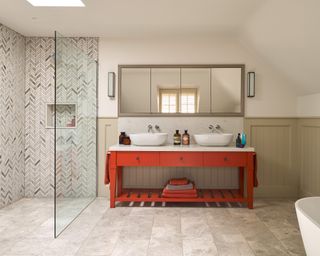 An example of bathroom color ideas showing a bathroom with a red double vanity unit