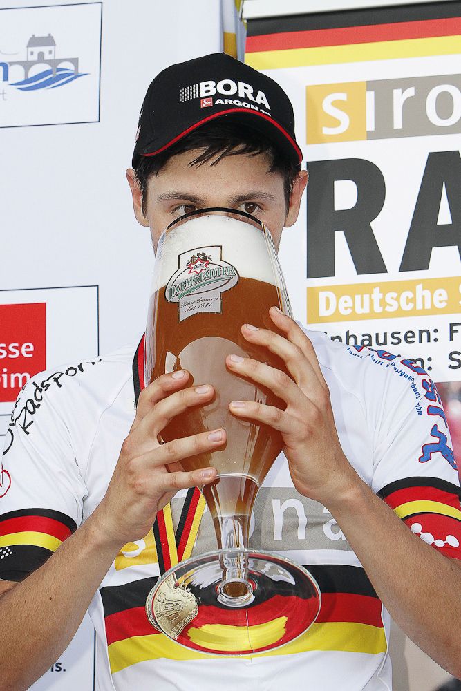 Emanuel Buchmann (Bora-Argon18) gets the big beer for his win.