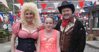Ah, that's better. Faye's Sporty Spice outfit might not be the most original at the Corrie's Jubilee Street party in 2012, but don't Anna and Owen look fabulous as Dolly Parton and...