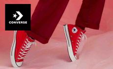 The converse logo over an image of some converse shoes