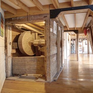 watermill with wooden flooring and wooden beams