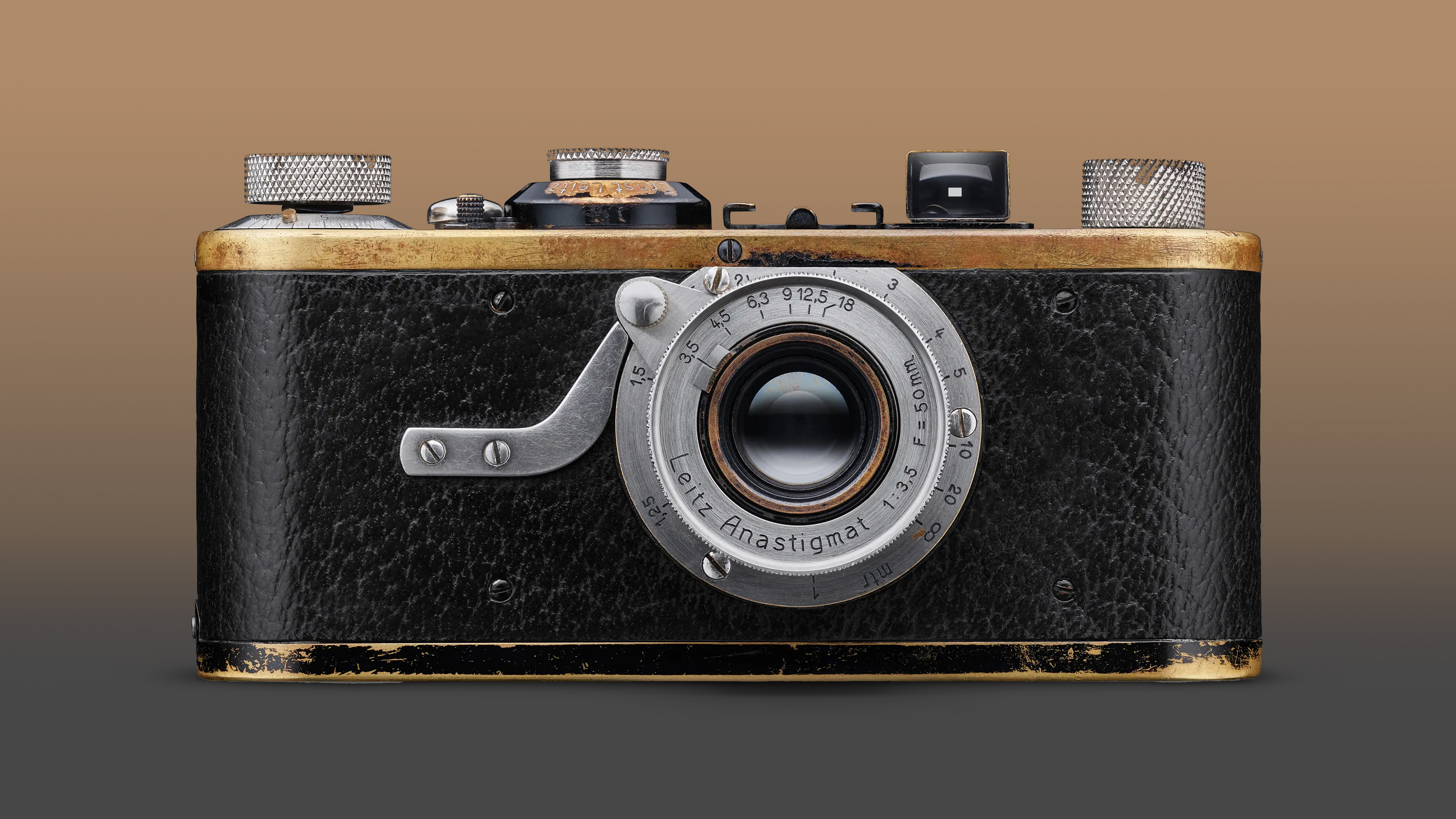 Leica I camera against a faded brown background