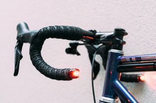 Bike lights against a white wall