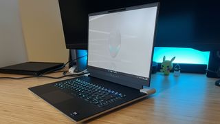 Alienware X16 R2 gaming laptop in a desk setup angled slightly away