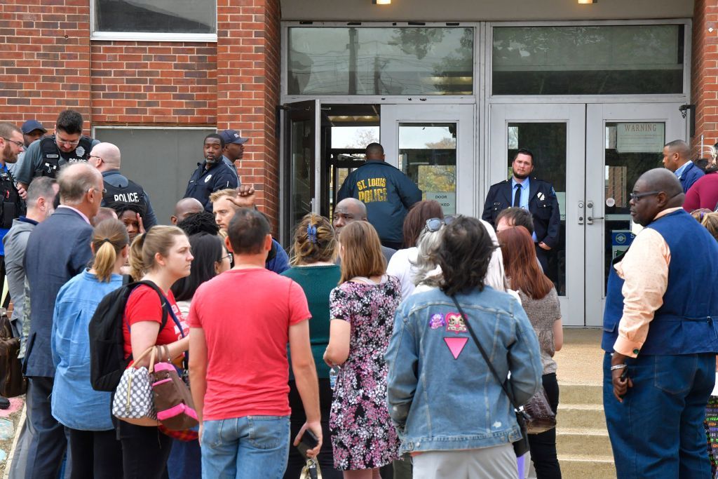 Students waiting outside S. Louis high school.