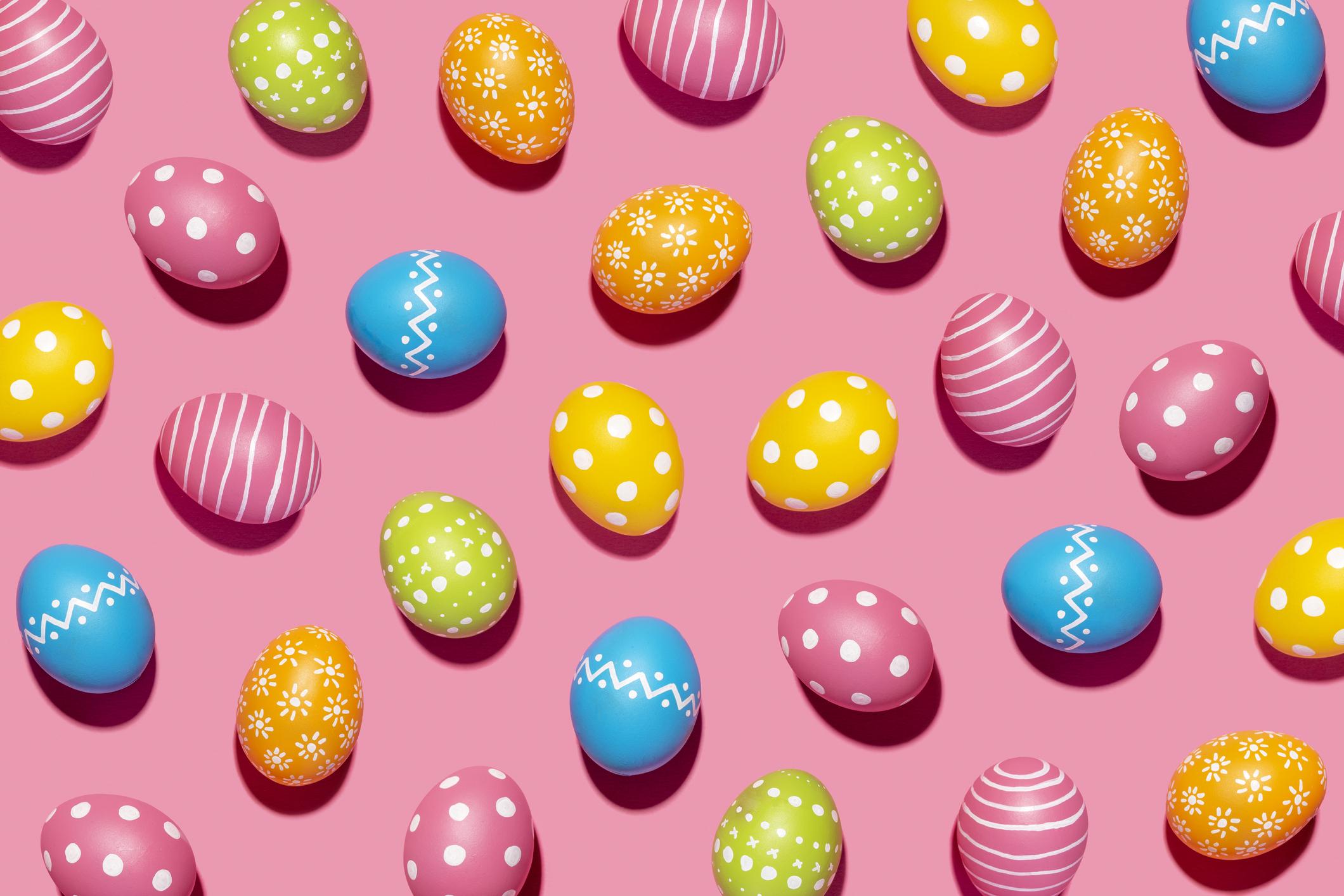  colourful Easter eggs on a pink background 