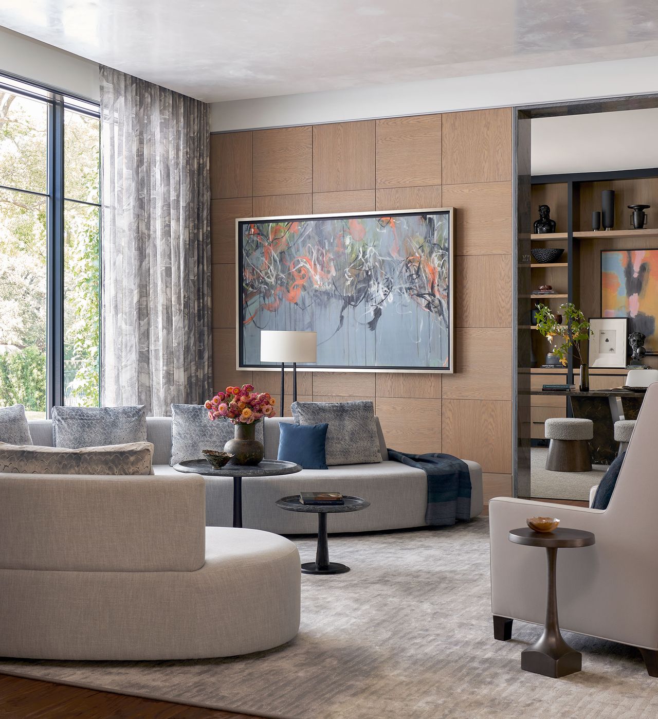 Living room with neutral colors gray curved sectional sofa