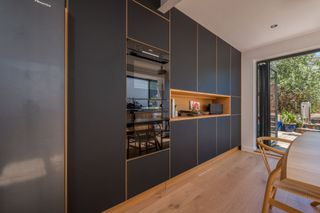 a handleless kitchen idea with a cut out section