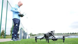 John De Caux operates the Inspire 3 drone at Man City training ground