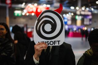 A visitor holds a mask of Ubisoft during the Paris Games Week fair in Paris, on October 23, 2024. (Photo by Dimitar DILKOFF / AFP) (Photo by DIMITAR DILKOFF/AFP via Getty Images)