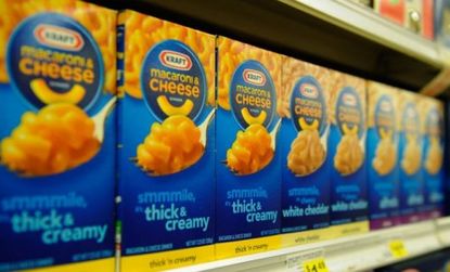Boxes of Kraft Macaroni & Cheese line a Los Angeles grocery store shelf: The food company is splitting into two publicly traded companies.