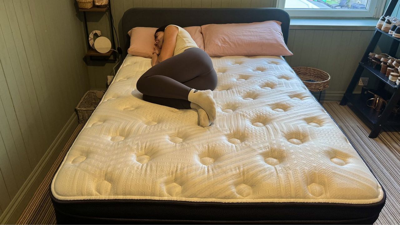 Our mattress tester laying on the Brooklyn Bedding Thermobalance LX Elite in their home
