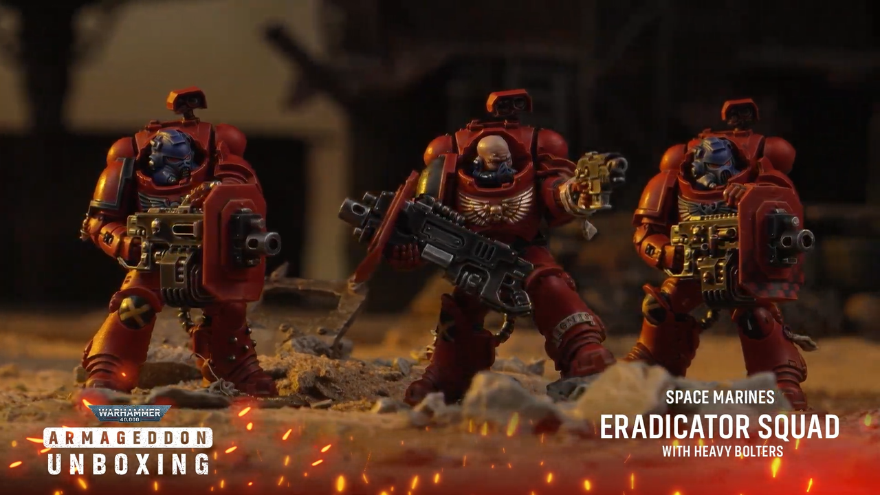 Warhammer 40K Space Marine models on a rocky battlefield