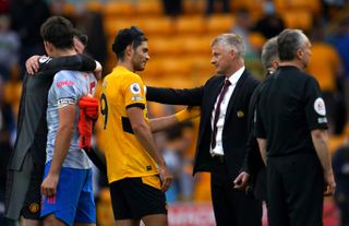 Manchester United manager Ole Gunnar Solskjaer speaks with Wolverhampton Wanderers’ Raul Jimenez after the final whistle during the Premier League match at Molineux Stadium, Wolverhampton. Picture date: Sunday August 29, 2021